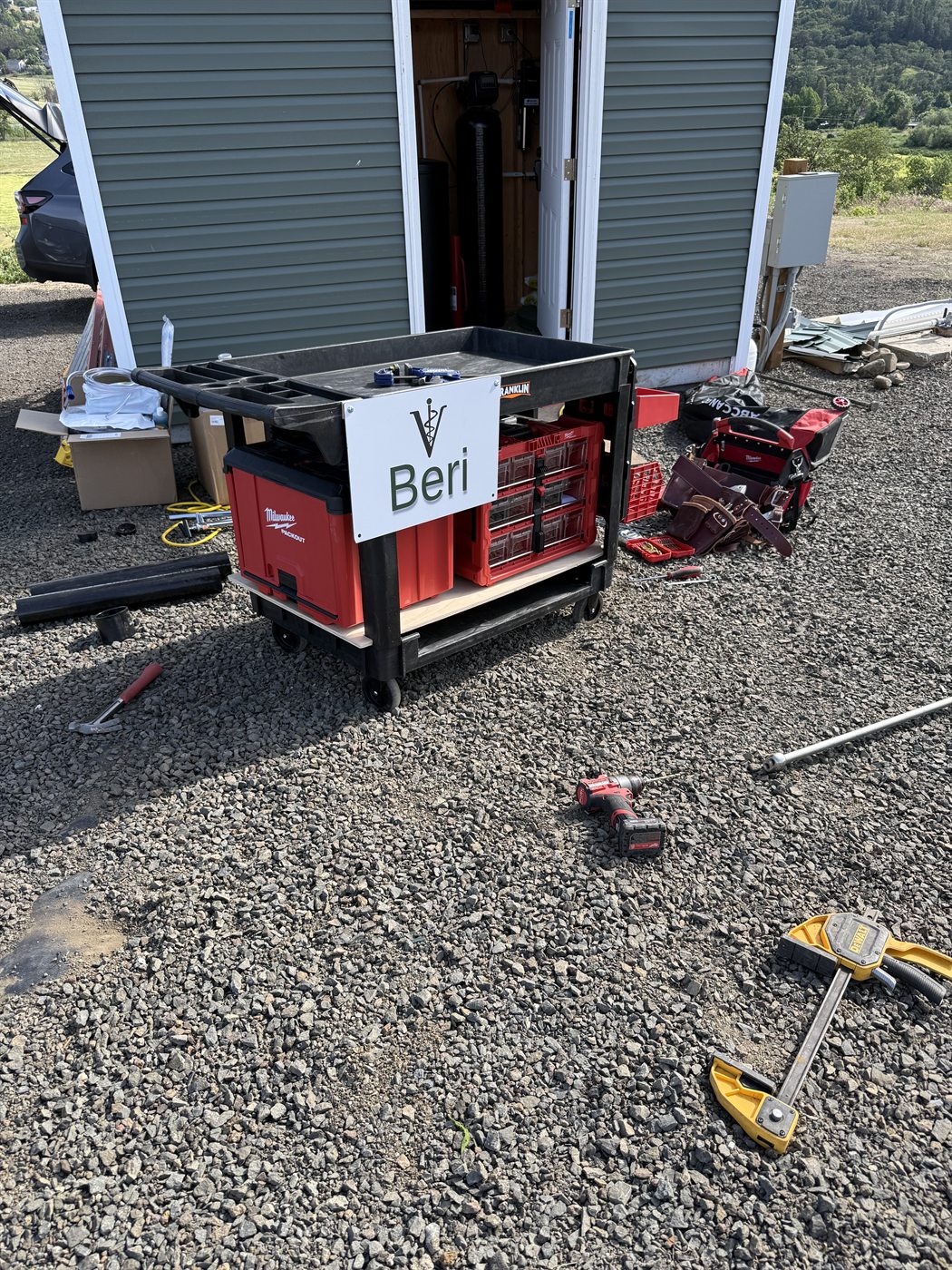 Donor sign reading Beri on the mobile tool and supply cart